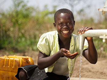 Girl with access to clean water in South Sudan